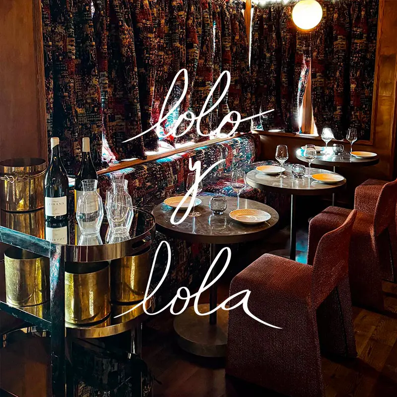 Lolo y Lola restaurant interior with an overlaying logo