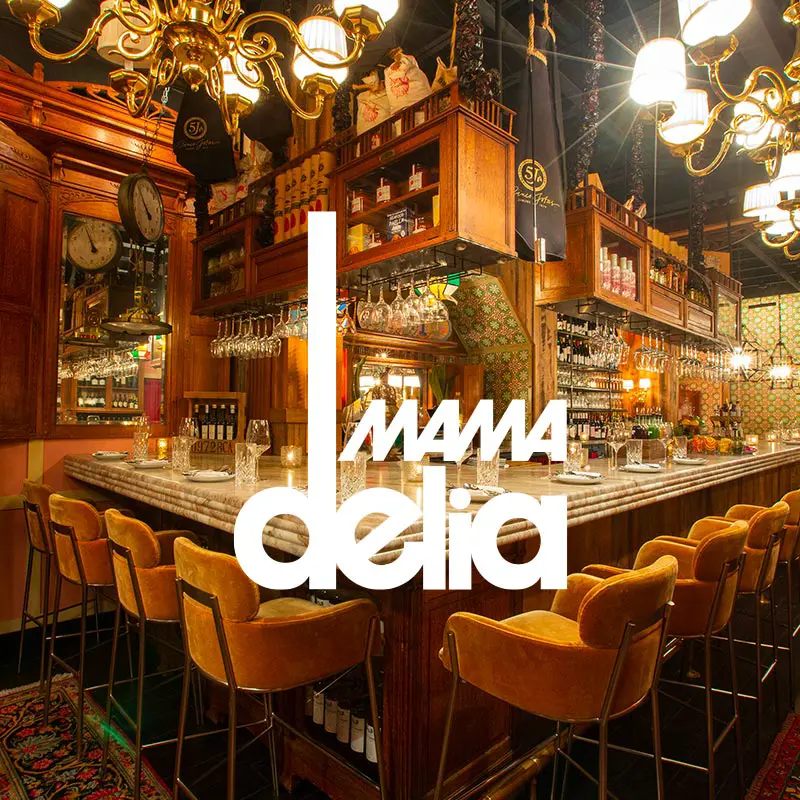 Mama Delia restaurant interior with an overlaying logo